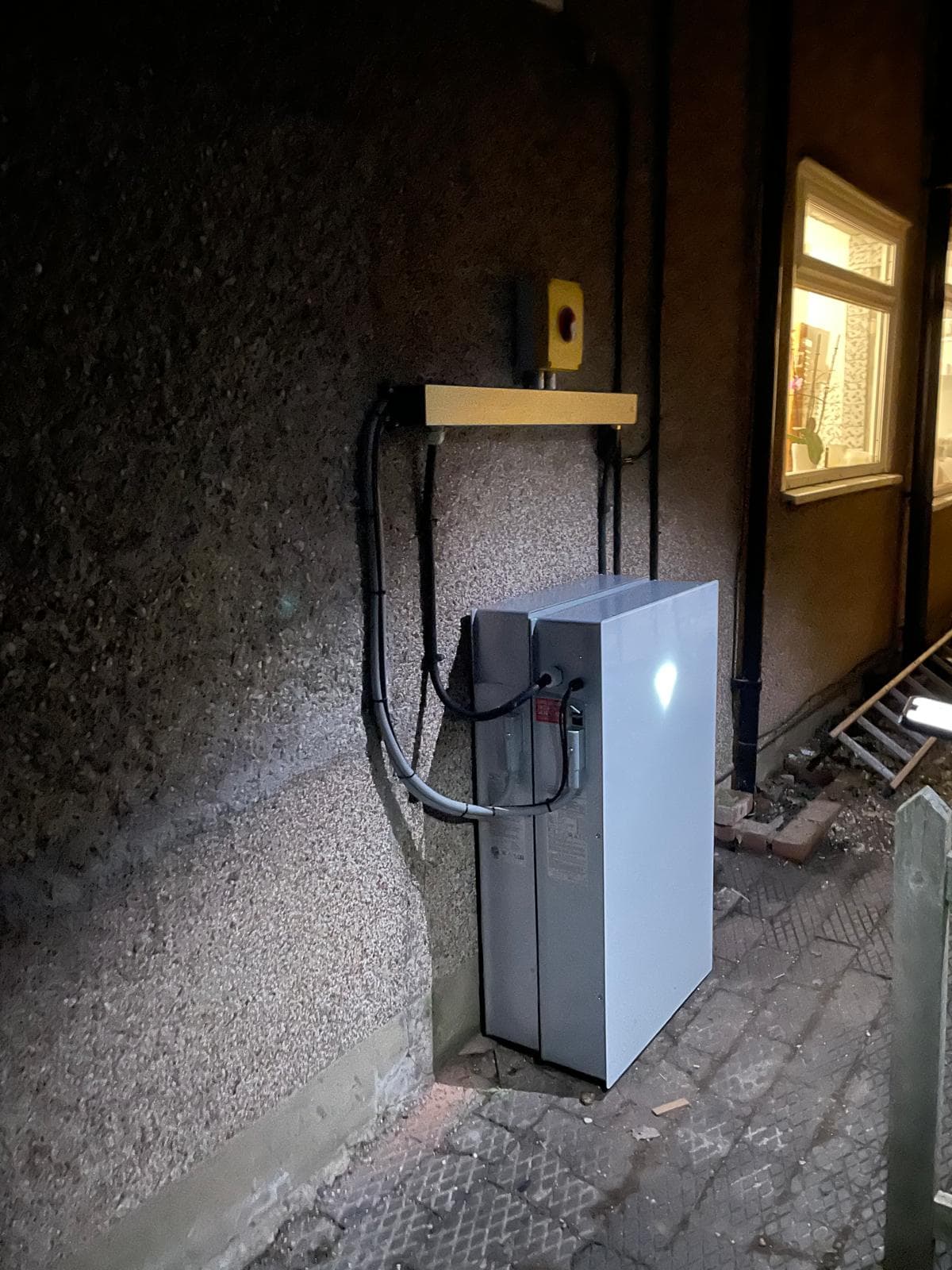 EV charger installed on exterior wall