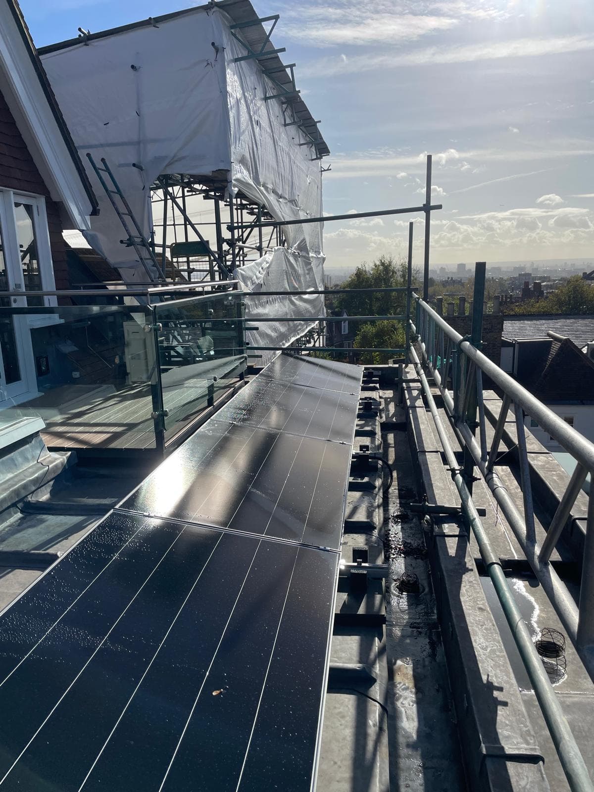 Solar panels installation in progress on rooftop