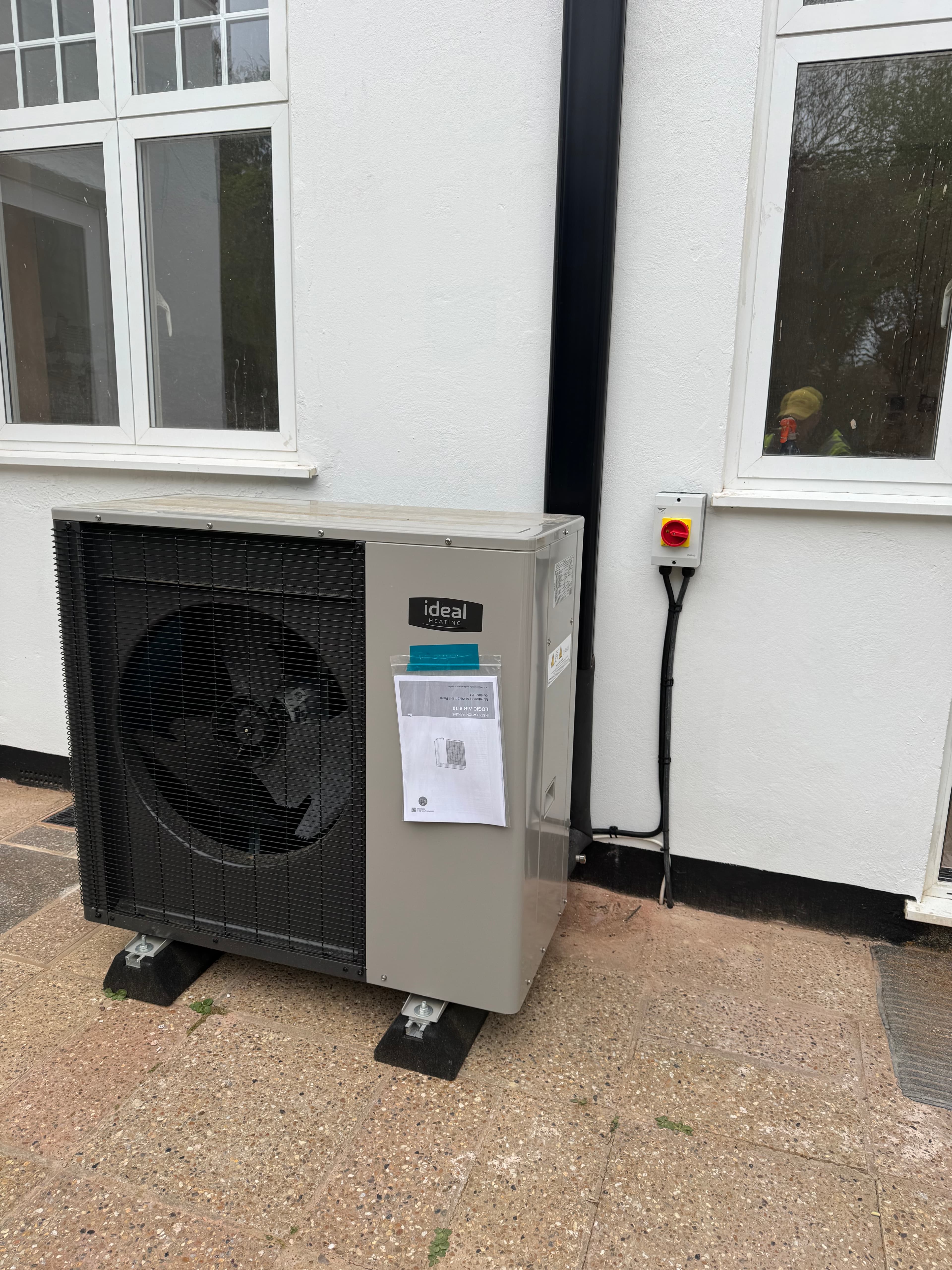 IDEAL Logic Air heat pump installed next to a house