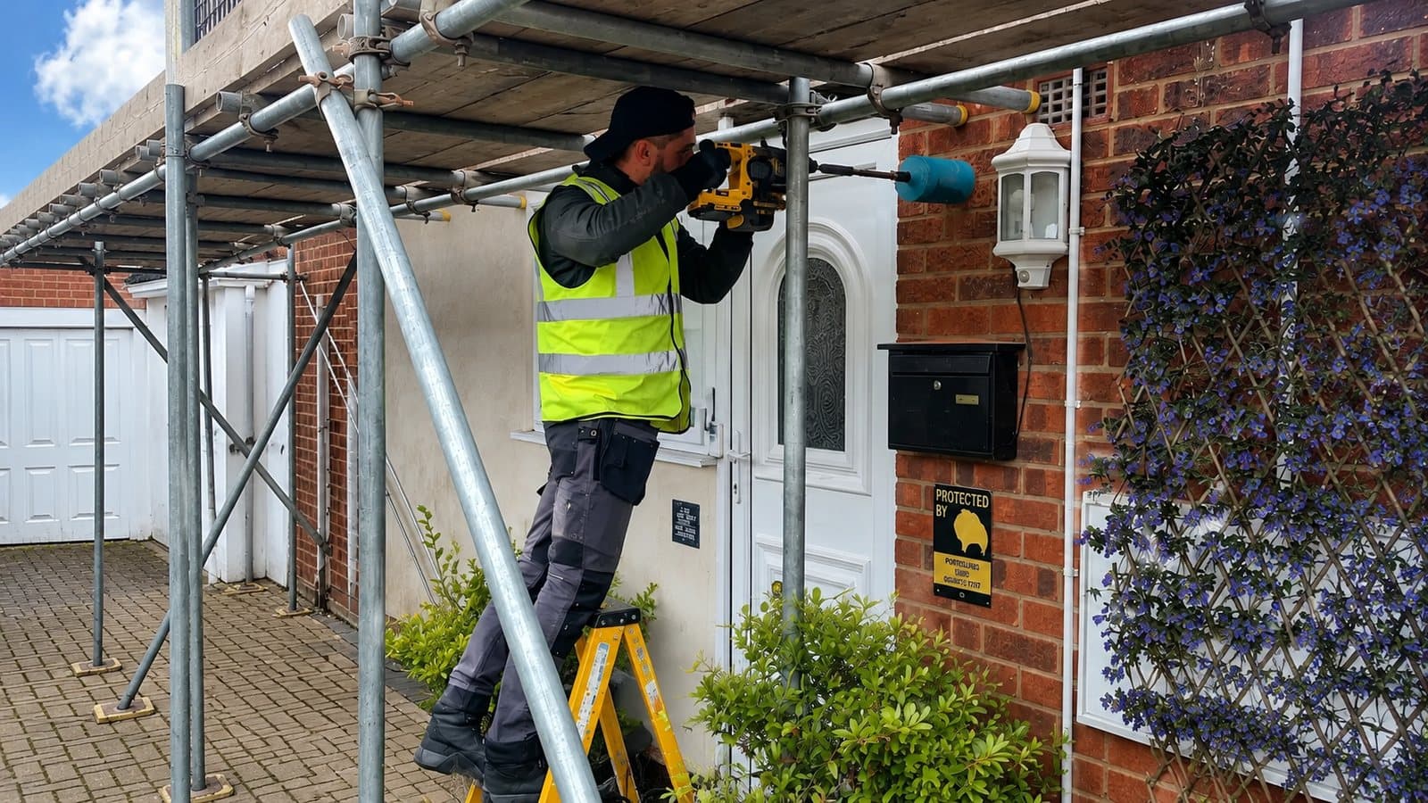 Britannia Energy installer fitting equipment from an access platform