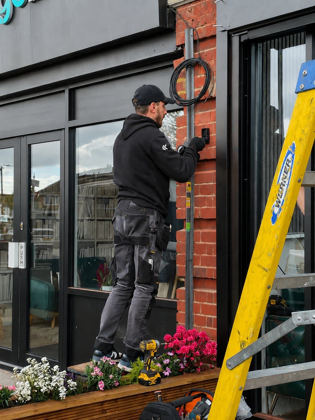 Britannia Energy engineer installing an EV charge point